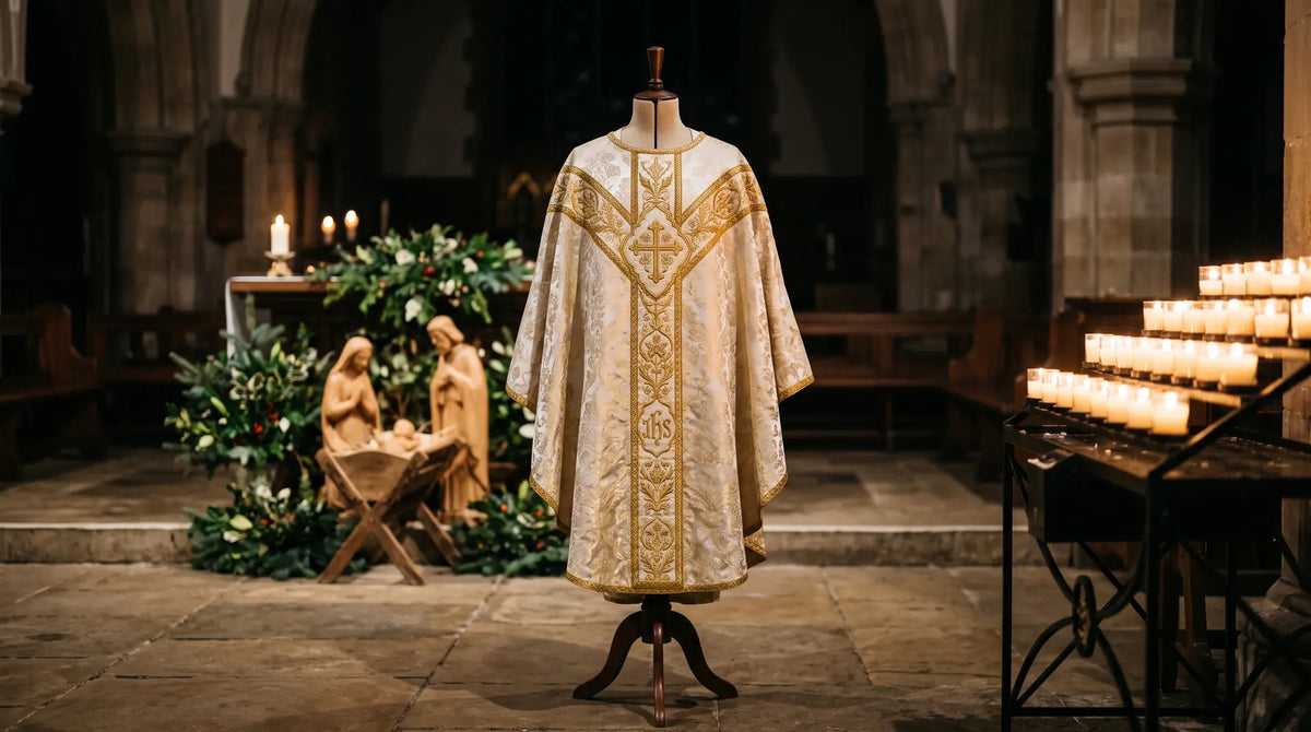 A white and gold brocade chasuble on a dress form in a candlelit church at Christmas