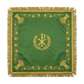 Green chalice veil laid flat, showing the gold Chi Rho in a wreath at the centre, wheat sheaves at the corners and gold bullion fringe.