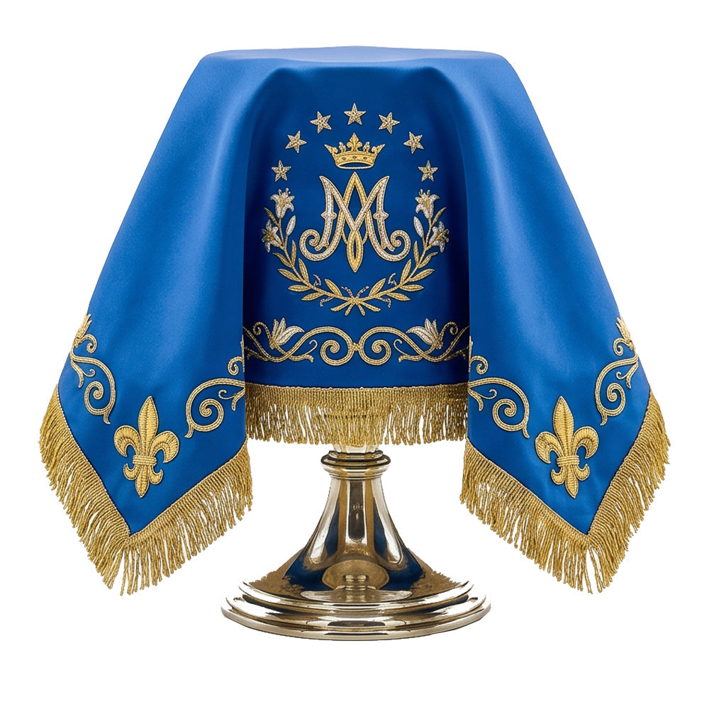 The Marian blue chalice veil draped over a chalice, with the crowned Ave Maria monogram to the front.