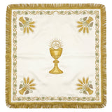Ivory-white chalice veil laid flat, showing the gold chalice beneath the IHS host, wheat sheaves at the corners and a gold border.