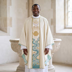 A priest wearing the ivory baptism chasuble with the dove, scallop shell and Jordan river orphrey, standing beside a stone baptismal font