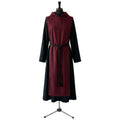 Front view of a black monk habit with a burgundy scapular, hood and black rope cincture.