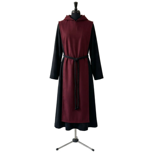 Front view of a black monk habit with a burgundy scapular, hood and black rope cincture.