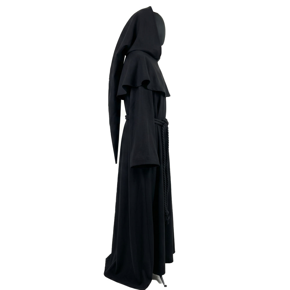 Side profile of a black monk habit showing the standing hood, flared capelet and bell sleeve together.