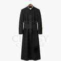 Front view of a black clergy cassock robe on a hanger, showing the stand collar and the wide sash belt with hanging tassel.