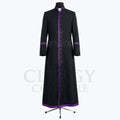 Front view of a black clergy cassock robe with a full-length purple button placket and purple piping at the collar.