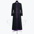 Front view of a black clergy cassock robe with a full-length purple button placket and purple piping at the collar.