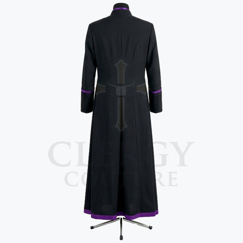 Angled front view of the black cassock robe showing the purple cuff band and the purple band at the hem.