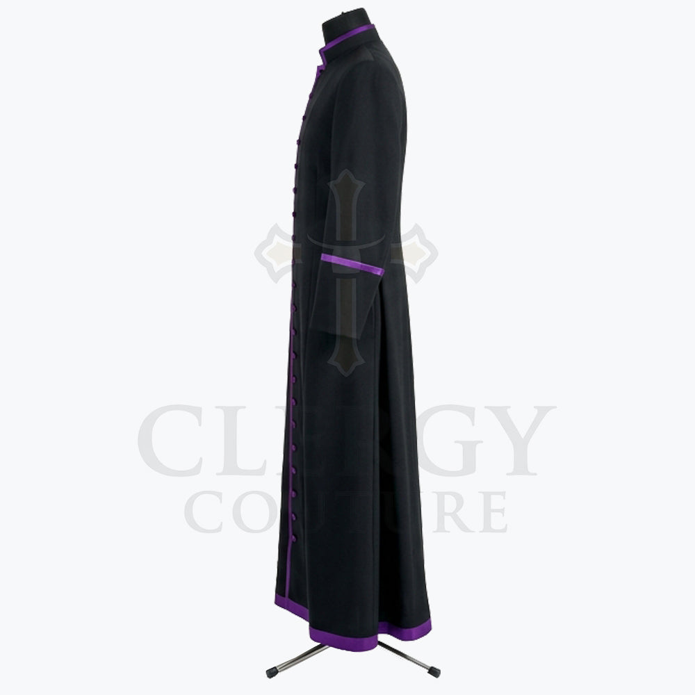 Back view of the black purple-trimmed cassock robe, showing the plain back and the centre vent through the skirt.