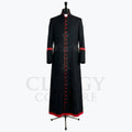 Front view of a black clergy cassock robe with a full-length red button placket and red piping at the collar.