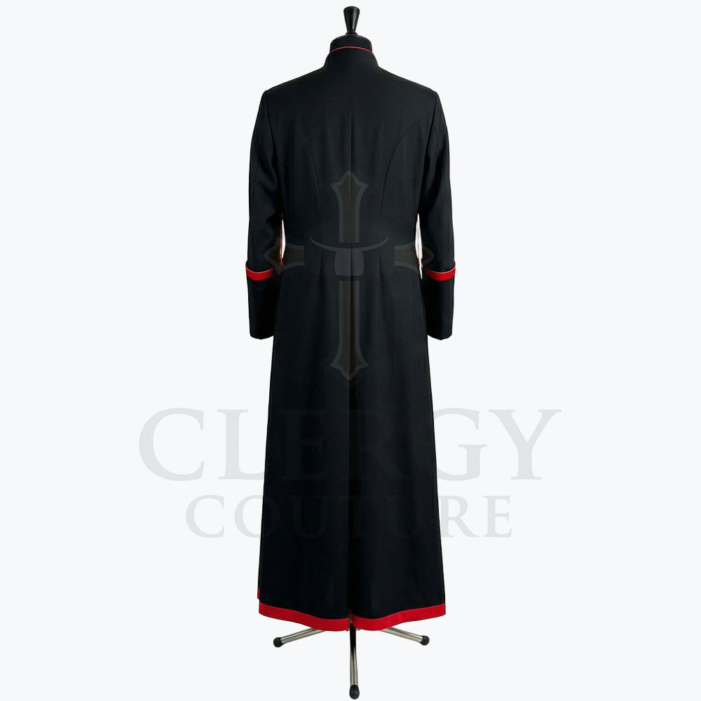 Back view of the black red-trimmed cassock robe, showing the plain back and the centre vent through the skirt.