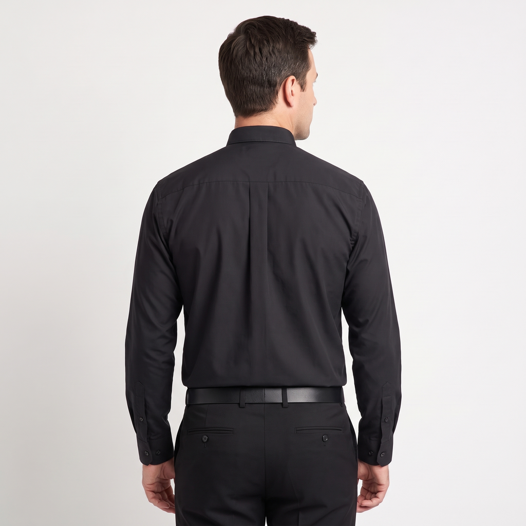 Back view of the black clergy shirt showing the shoulder yoke and centre pleat.