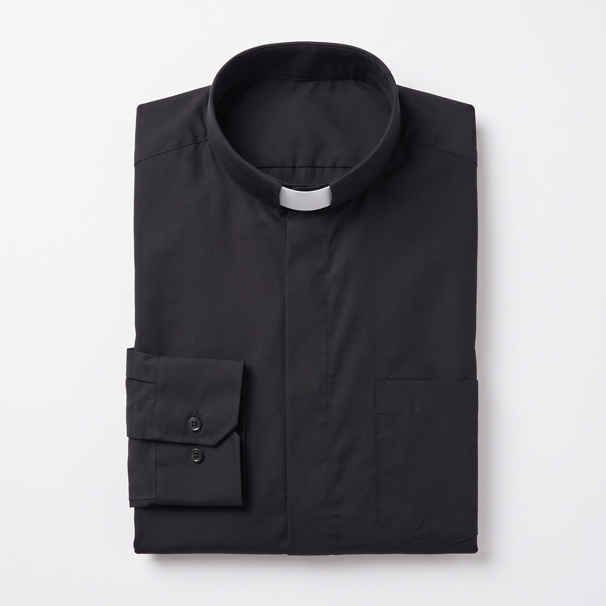 The black long-sleeve clergy shirt folded, with the collar standing and a buttoned barrel cuff visible.