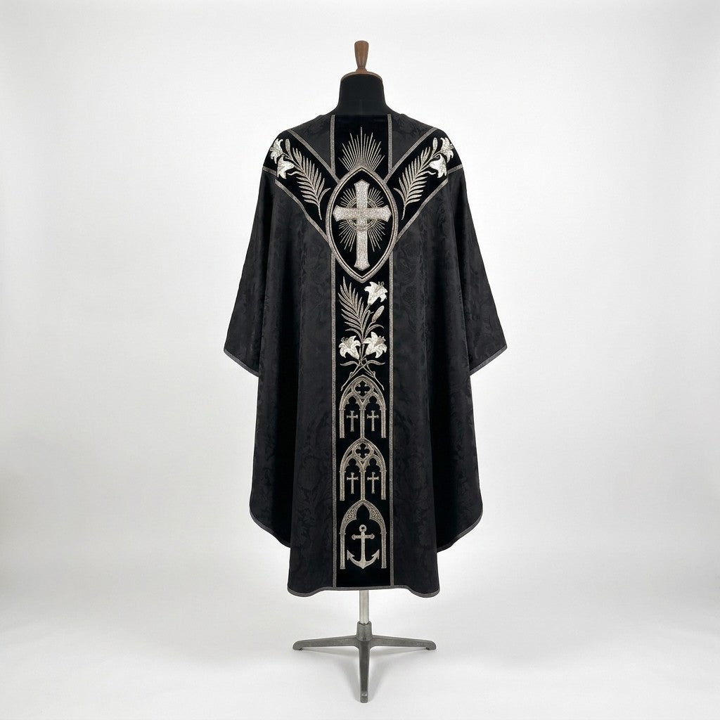 Back of the black requiem chasuble with a Y-shaped velvet orphrey: radiant cross, palms, white lilies, gothic arches with crosses and an anchor at the hem