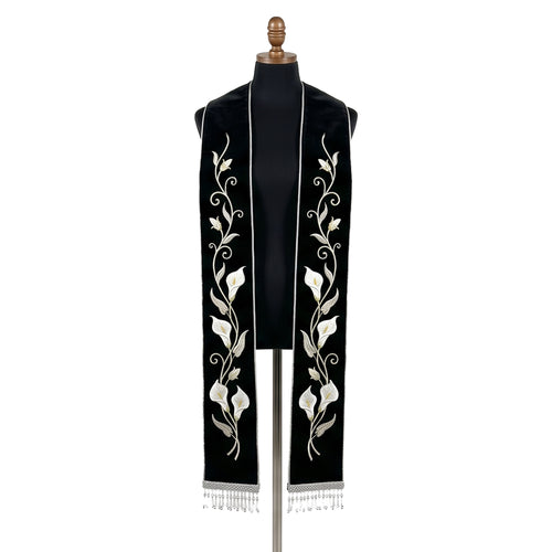 Black velvet-look stole with a white calla lily vine embroidered down both panels above silver beaded fringe