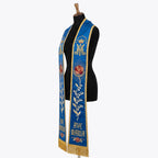 Angled view of the blue Marian stole showing the crown, rose, bell flowers and Ave Maria lettering together