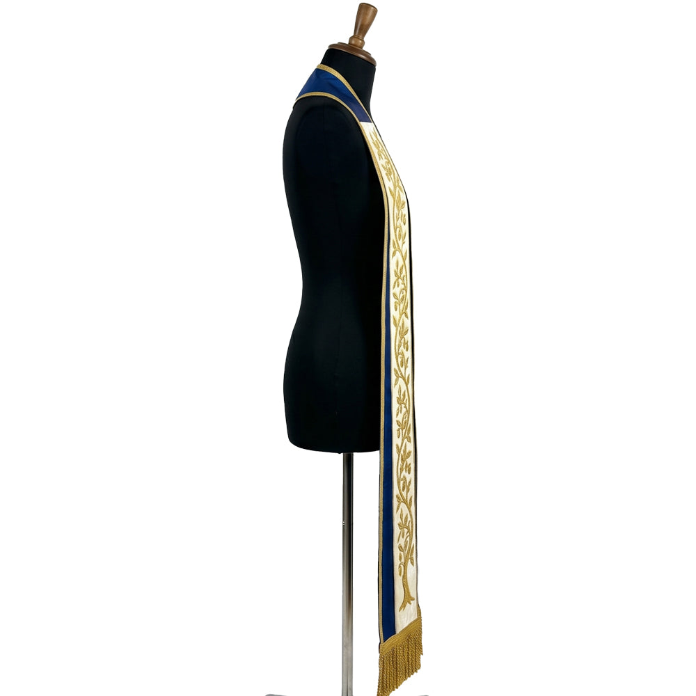 Close view of one ivory band on the blue stole, showing the raised gold vine, leaves and small fruit in detail.