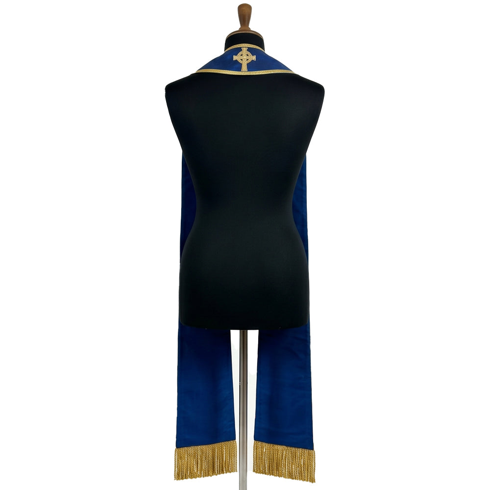 Back neck of the blue clergy stole, showing a gold-embroidered Celtic ring cross centred above the shoulders.