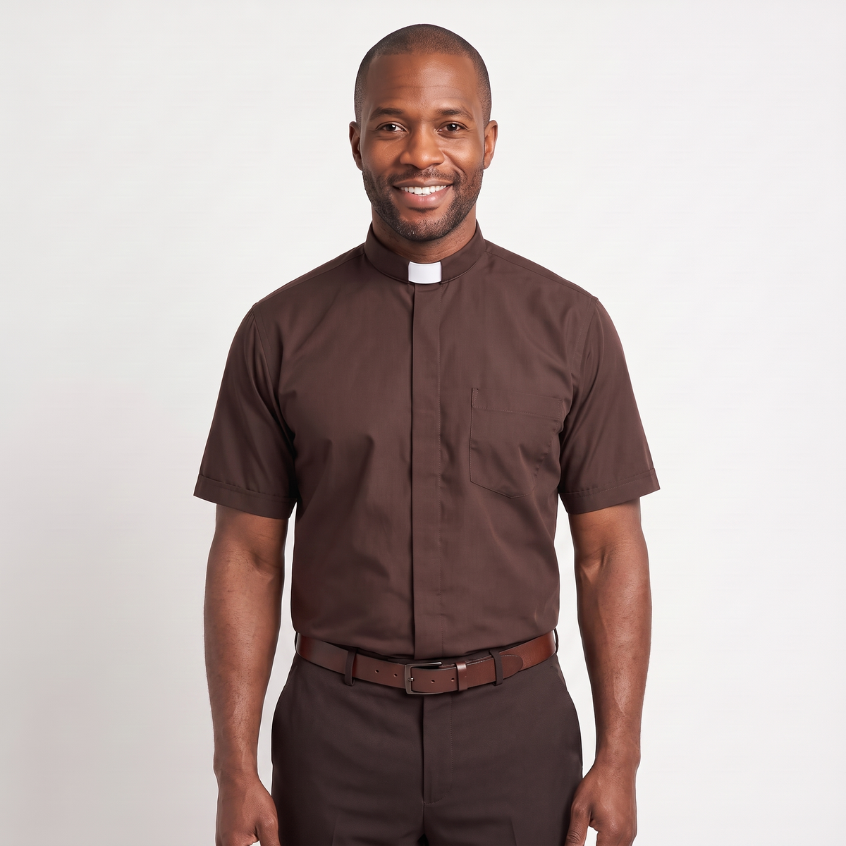 The short-sleeve version of the brown tab-collar clergy shirt, worn with dark trousers.