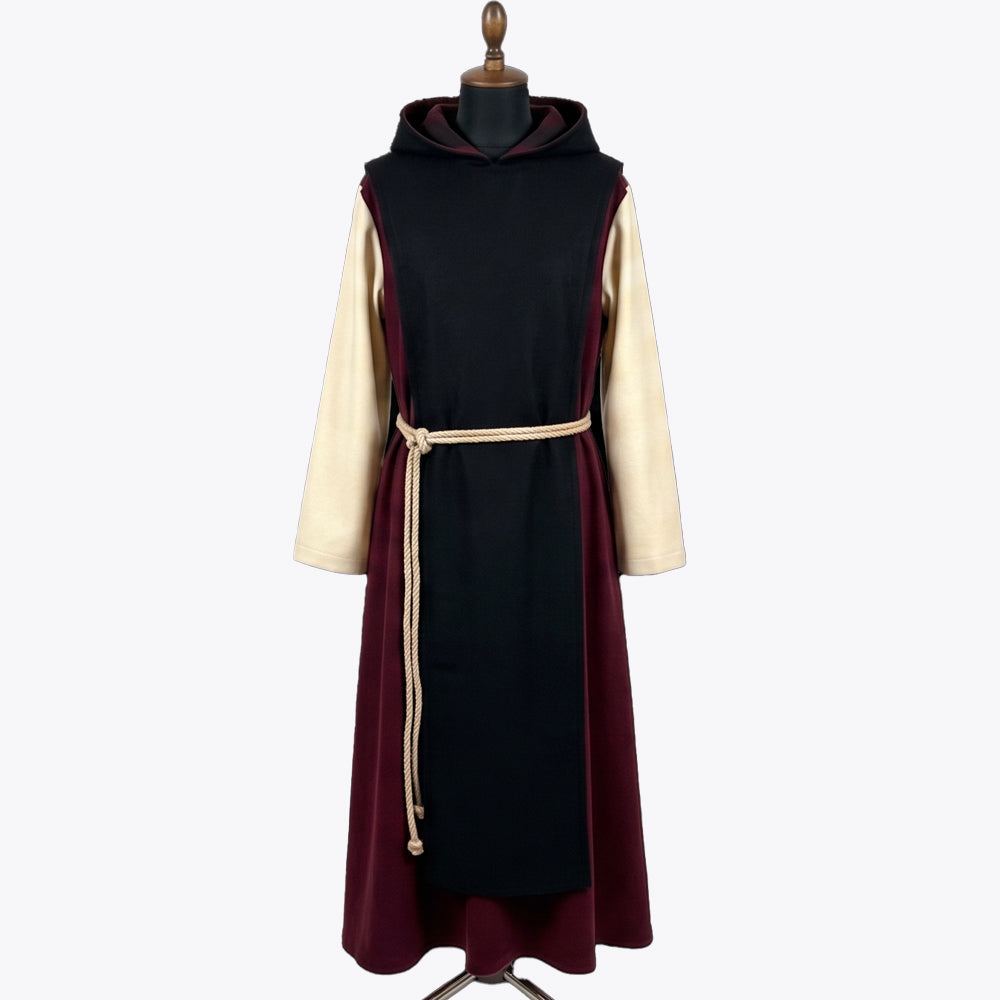 Front view of a burgundy monk habit with a black scapular and contrasting ivory sleeves