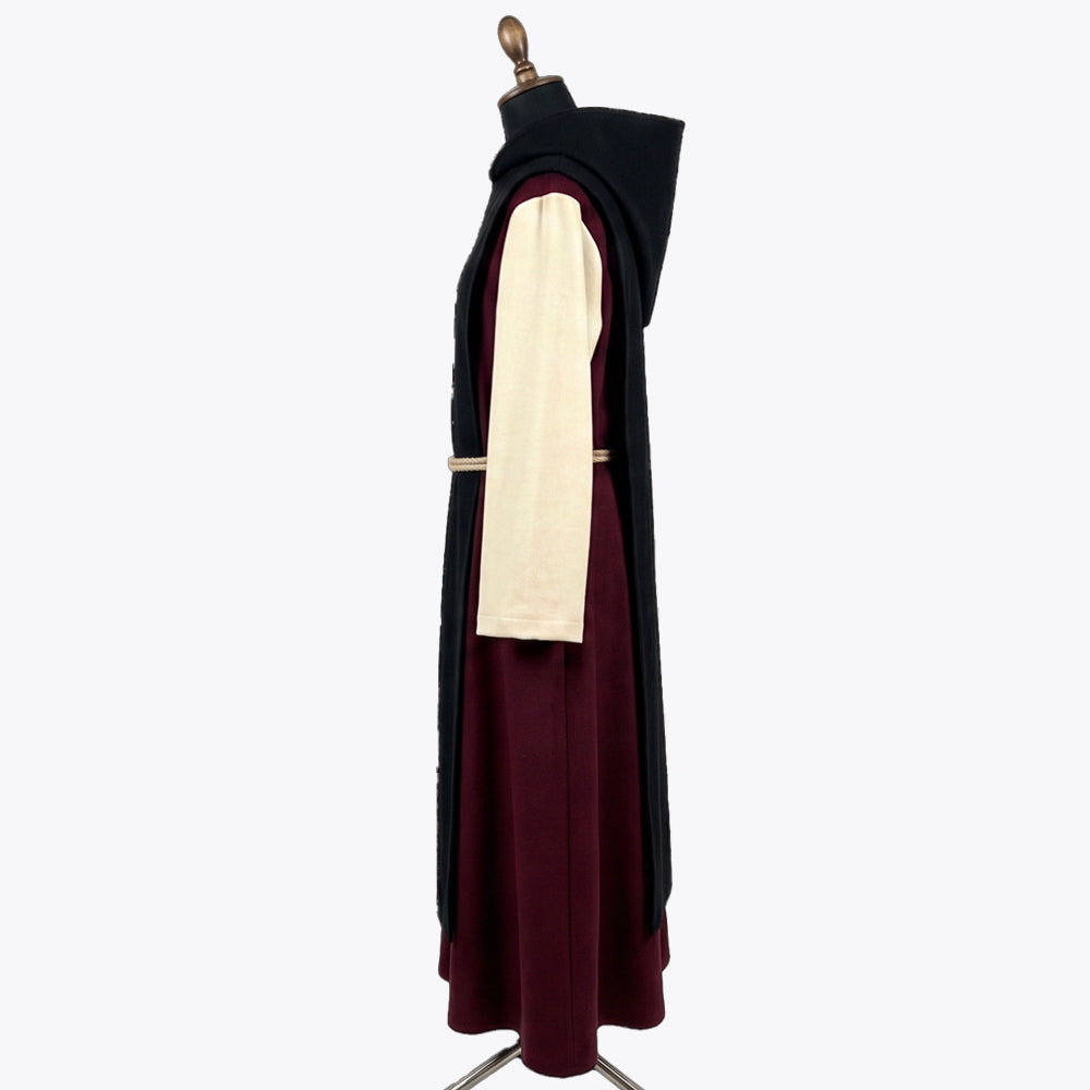 Side profile of the burgundy monk habit showing the hood lining and ivory sleeve fabric