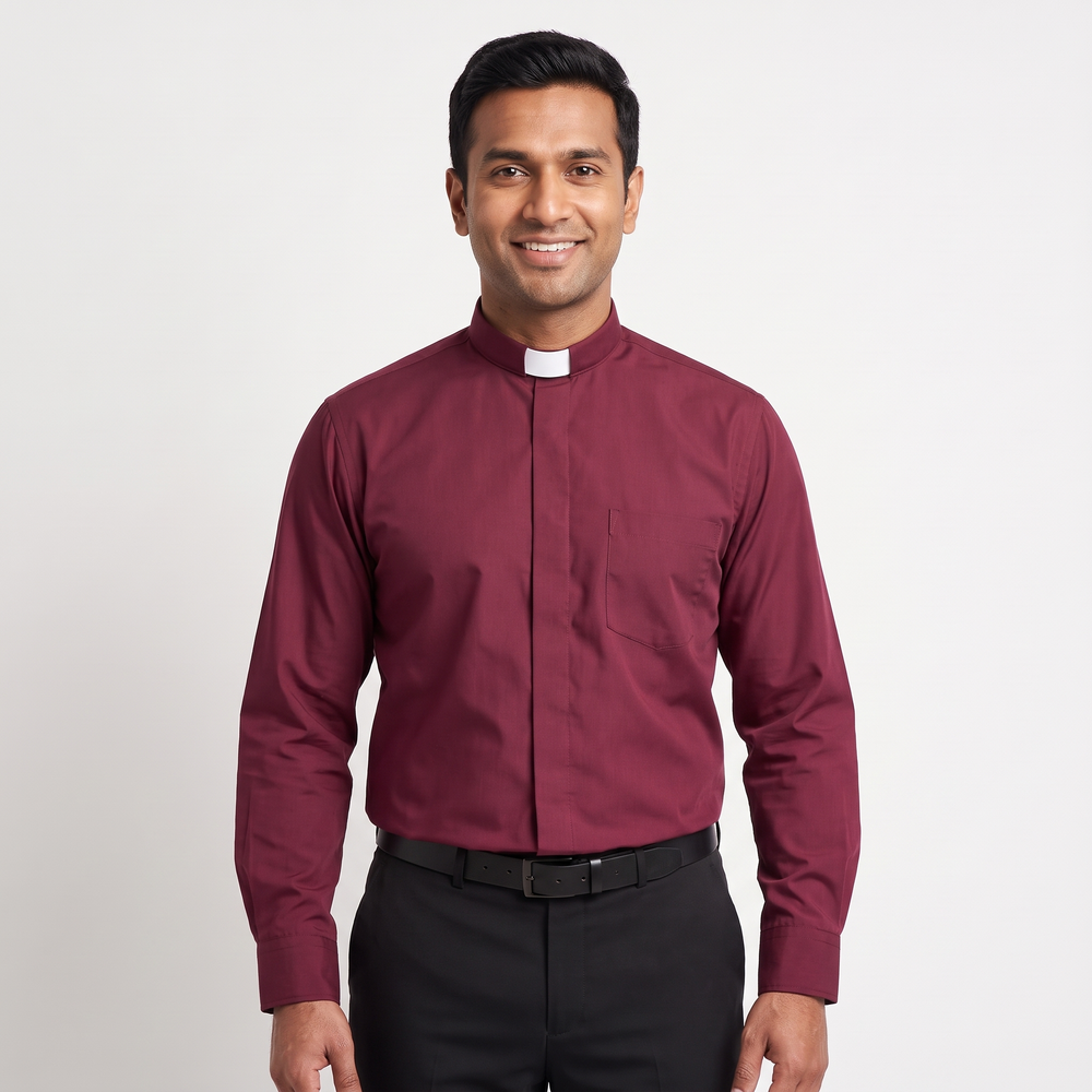 Man wearing the burgundy long-sleeve tab-collar clergy shirt with a white tab (shown for styling, not included), covered placket and left chest pocket, against a light grey background.