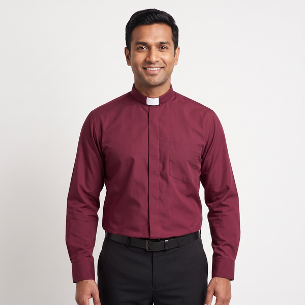 Man wearing the burgundy long-sleeve tab-collar clergy shirt with a white tab (shown for styling, not included), covered placket and left chest pocket, against a light grey background.