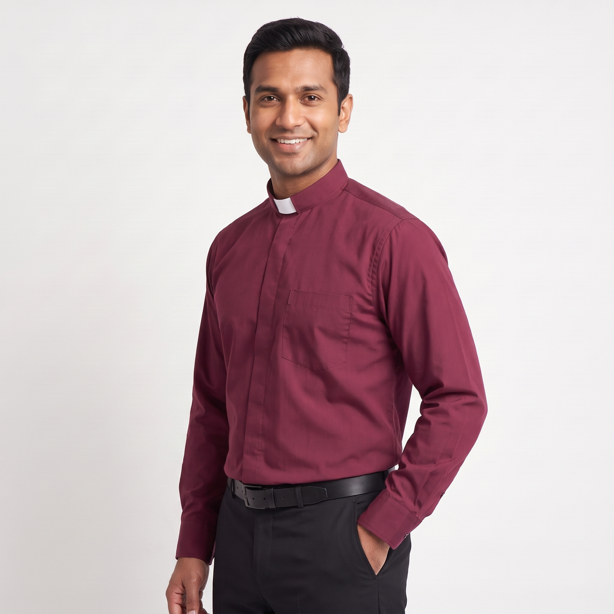 Three-quarter view of the burgundy clergy shirt showing the collar profile, sleeve and cuff.