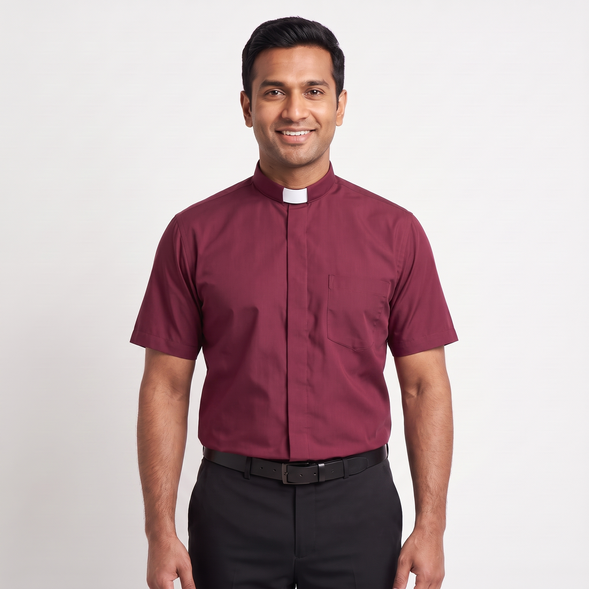 The short-sleeve version of the burgundy tab-collar clergy shirt, worn with dark trousers.