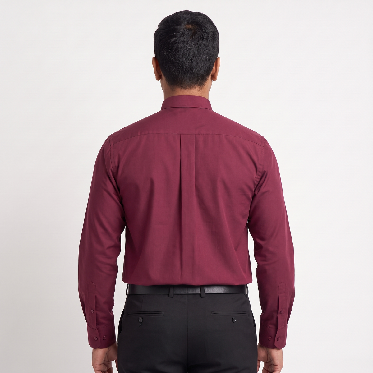 Back view of the burgundy clergy shirt showing the shoulder yoke and centre pleat.