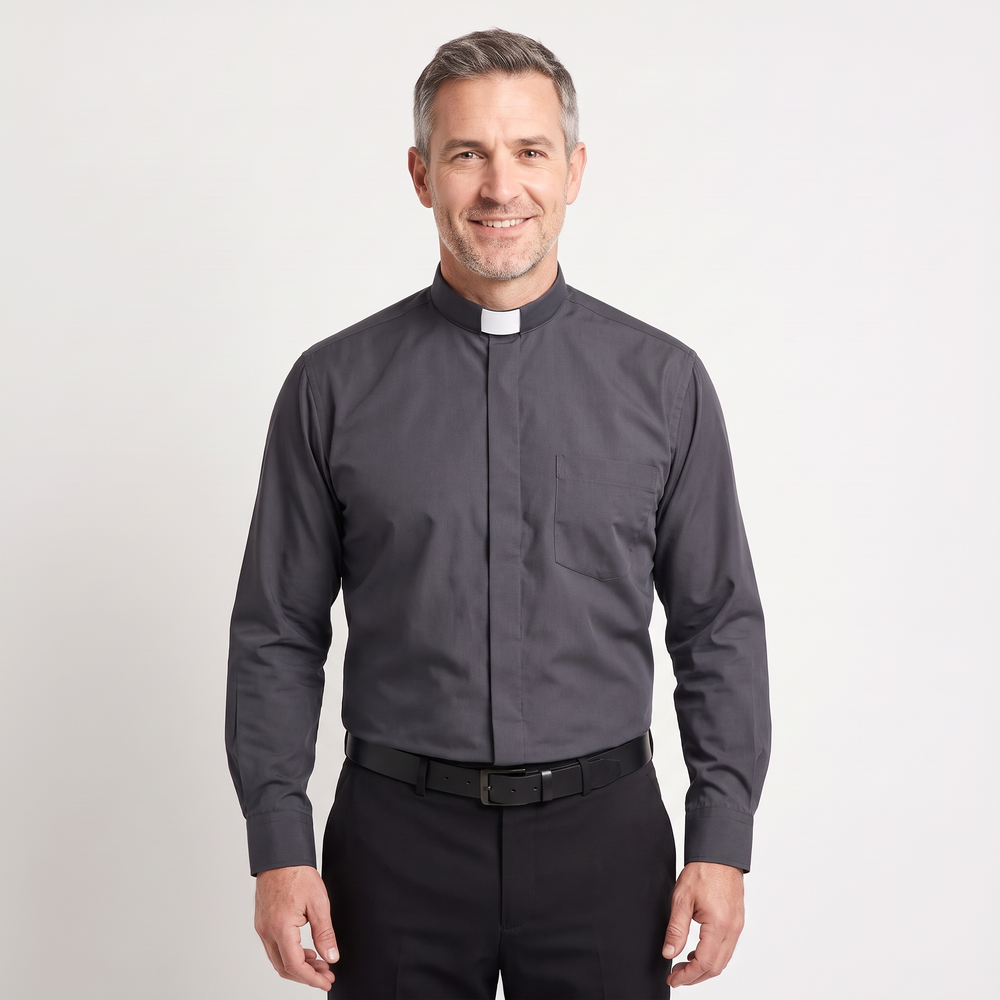 Man wearing the charcoal long-sleeve tab-collar clergy shirt with a white tab (shown for styling, not included), covered placket and left chest pocket, against a light grey background.