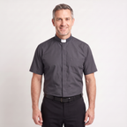 The short-sleeve version of the charcoal tab-collar clergy shirt, worn with dark trousers.
