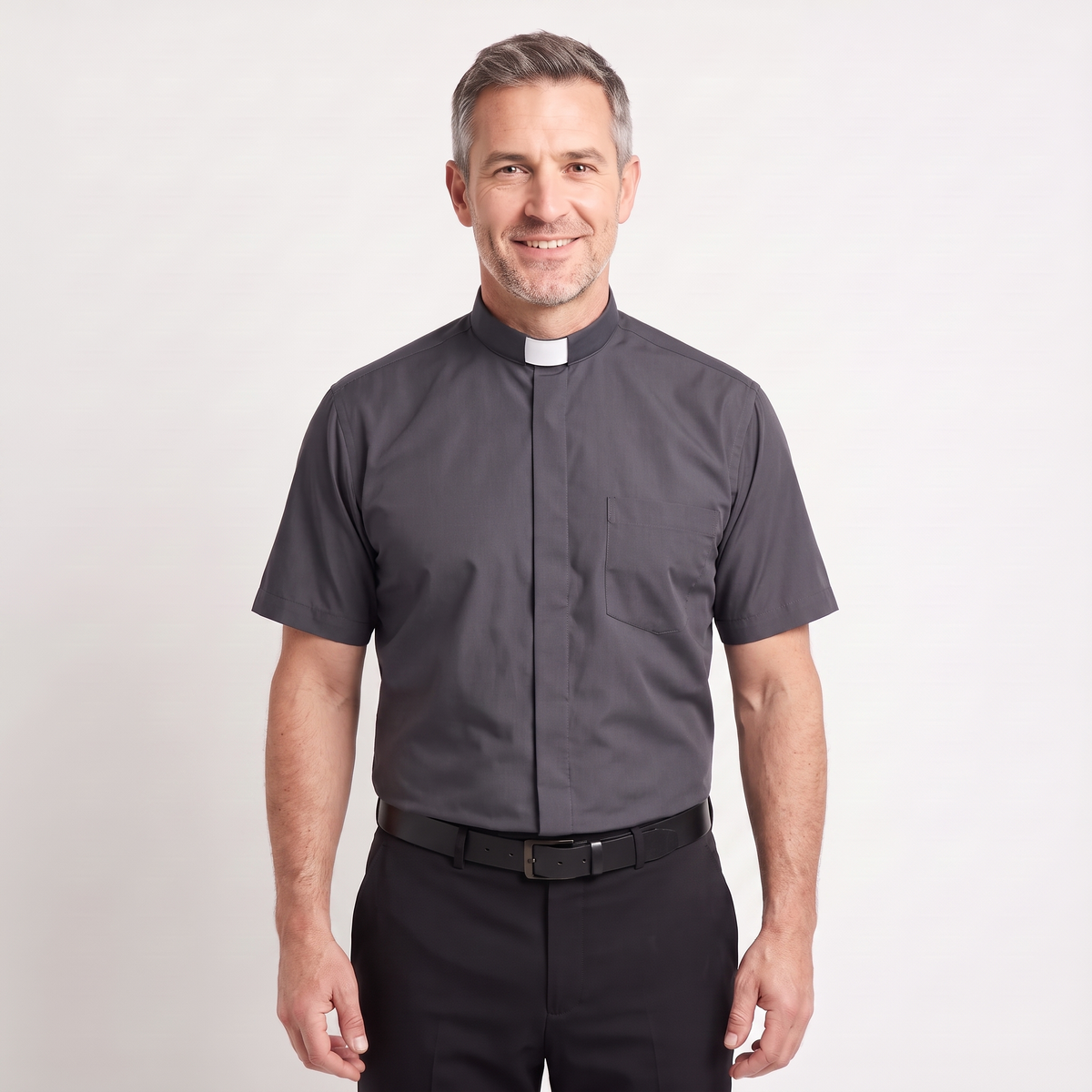 The short-sleeve version of the charcoal tab-collar clergy shirt, worn with dark trousers.