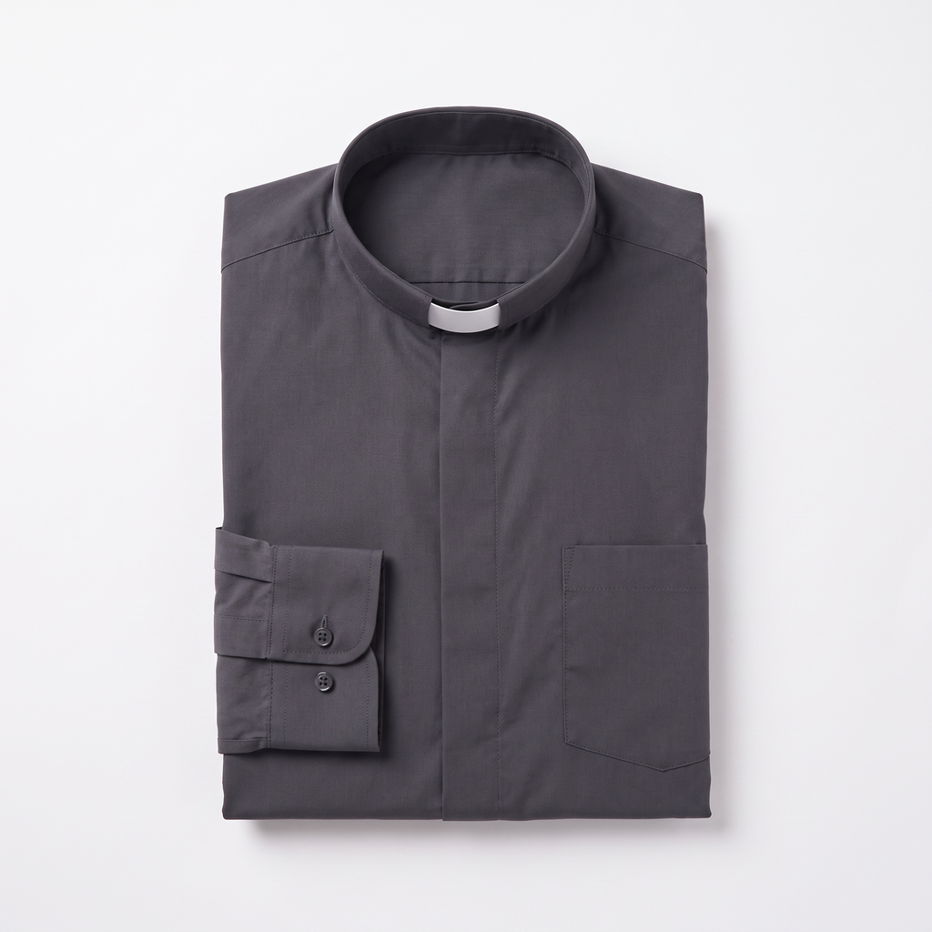 The charcoal long-sleeve clergy shirt folded, with the collar standing and a buttoned barrel cuff visible.