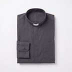 The charcoal long-sleeve clergy shirt folded, with the collar standing and a buttoned barrel cuff visible.