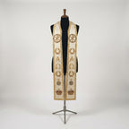 Ivory priest stole on a mannequin, gold Chi Rho medallion, wreath, Alpha and Omega and crown on both panels.