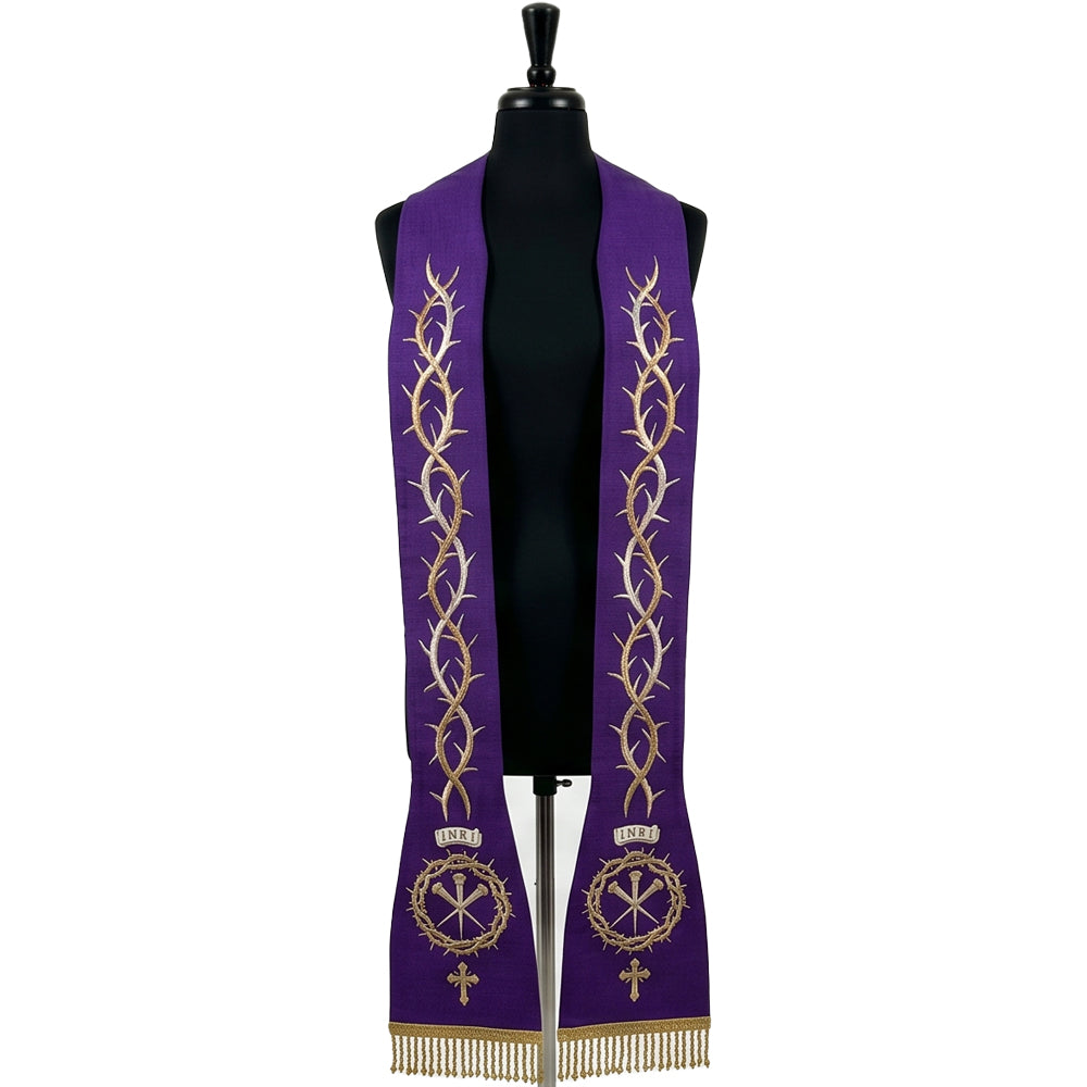 Violet Lent stole laid flat with a gold and silver crown-of-thorns vine running each panel down to a Chi Rho medallion.