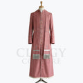 Front view of a dusty rose clergy cassock robe with silver crosses embroidered down the front panels and a silver-fringed chest panel.
