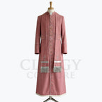 Front view of a dusty rose clergy cassock robe with silver crosses embroidered down the front panels and a silver-fringed chest panel.