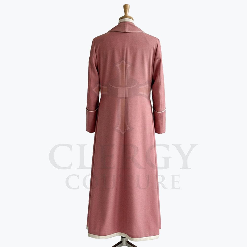 Back view of the dusty rose cassock robe, showing the plain back and the cream band at the hem.