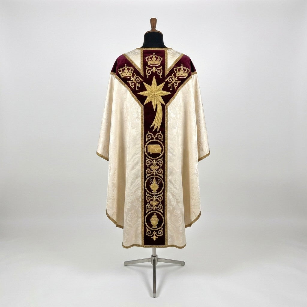 Back of the Epiphany chasuble with a Y-shaped burgundy velvet orphrey: three gold crowns, a large comet star and roundels holding a chest, a censer and a jar