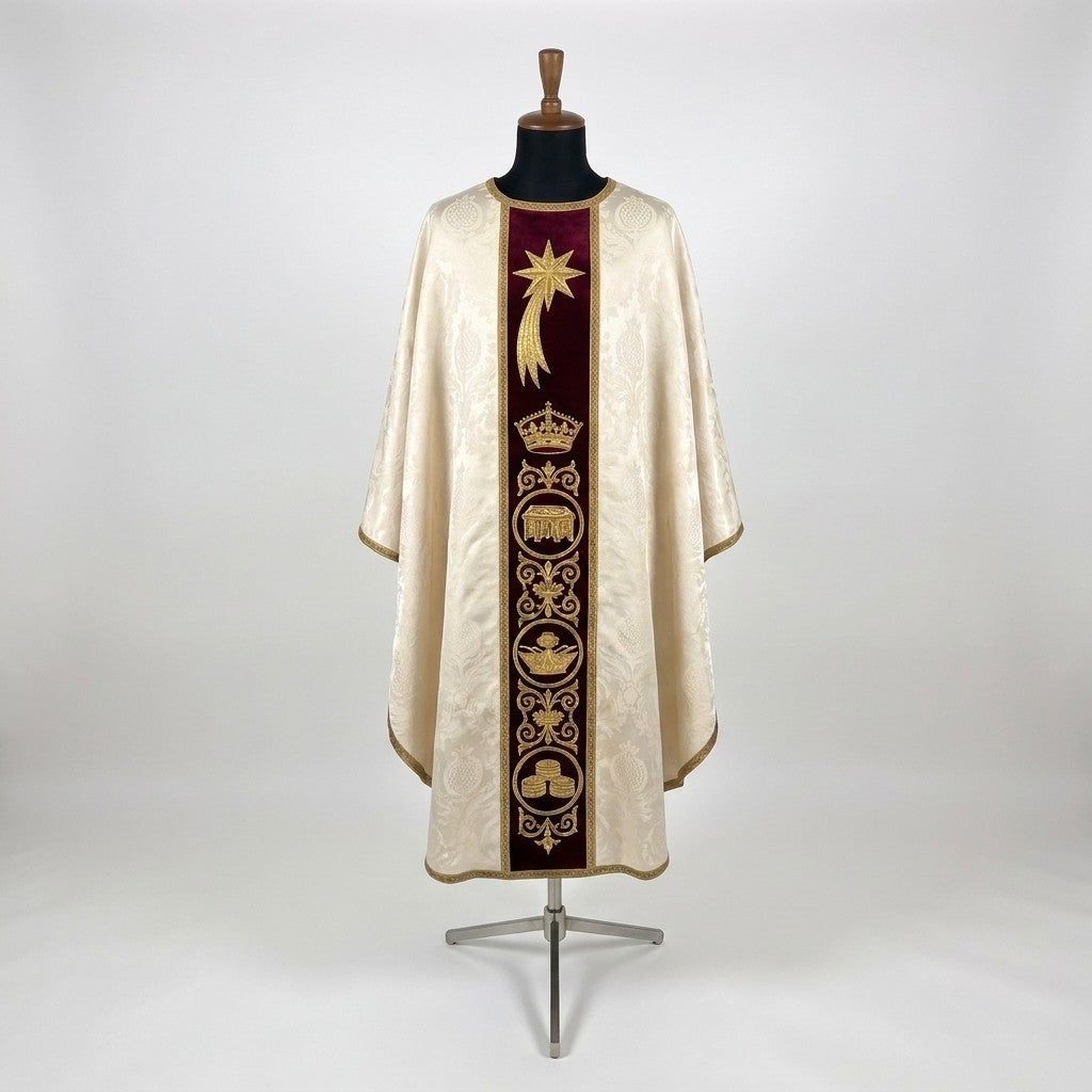 Front of an ivory damask Epiphany chasuble with a burgundy velvet column orphrey embroidered in gold with a comet star, a crown and roundels of the Magi's gifts