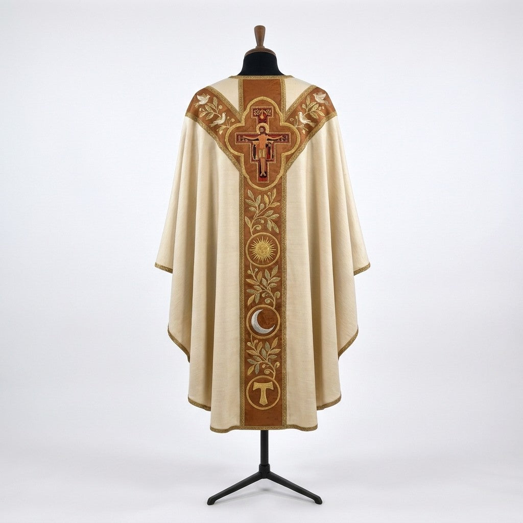 Back of the Franciscan chasuble with a Y-shaped terracotta orphrey: the San Damiano crucifix in a gold quatrefoil, doves, olive branches, sun, crescent moon and Tau