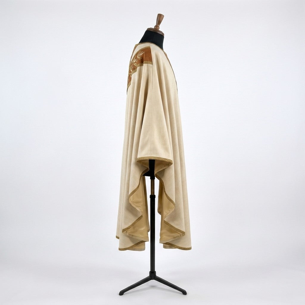 Side view of the ivory Franciscan chasuble showing the gothic drape and gold-toned lining