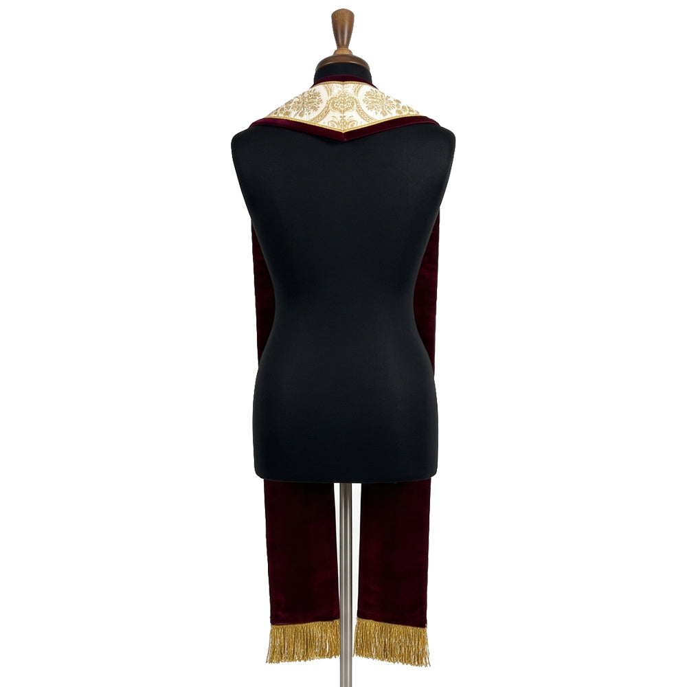 Back view of the gold brocade stole on a dress form, showing the plain woven brocade pattern and velvet-look edged collar.