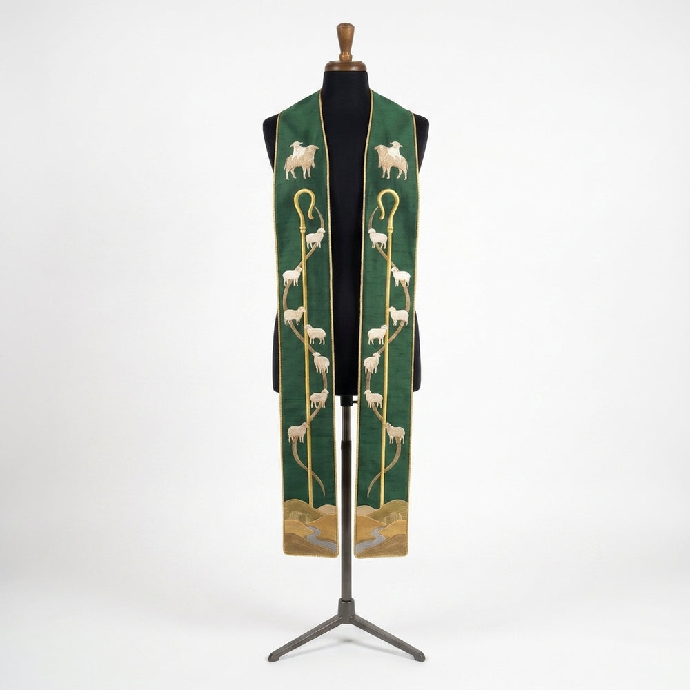 Front view of the Good Shepherd Stole with an embroidered crook, sheep trail and hillside scene