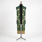 Front view of the Good Shepherd Stole with an embroidered crook, sheep trail and hillside scene