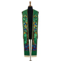 Green Tree of Life clergy stole on a bust form, both panels showing the stained-glass tree design and gold fringe hem.