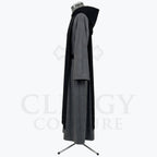 Side profile of the grey monk habit showing the black scapular layered over the tunic