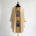 Front of an ivory chasuble with a gold damask column orphrey holding two arched panels: the Holy Family and the Star of Bethlehem
